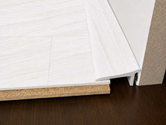White oak effct floor edge trim birdges gap between floor and skirting